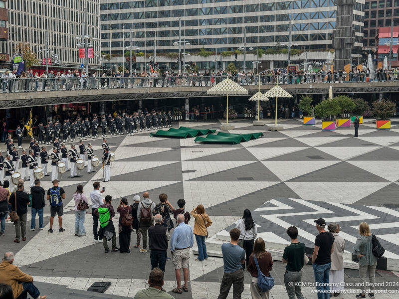 a group of people standing in a courtyard