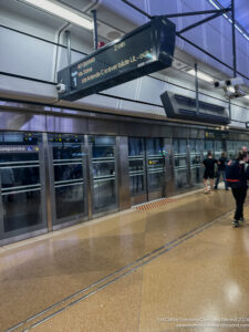 a group of people walking in a subway station