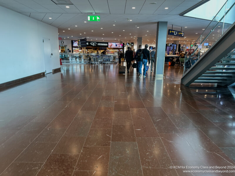 people walking in a large airport