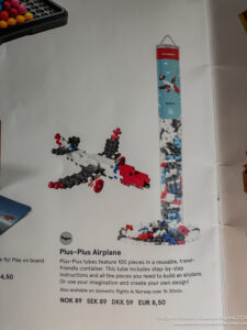 a book with a picture of a plane and a tall tower made of building blocks