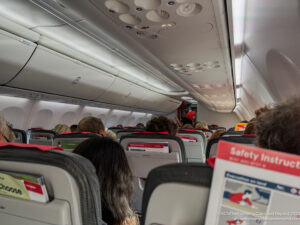 a group of people sitting in an airplane