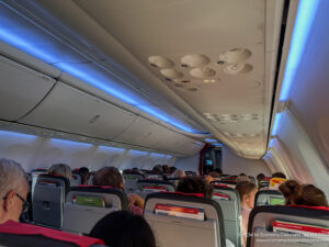a group of people sitting in an airplane