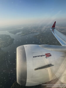 an airplane wing and body of water