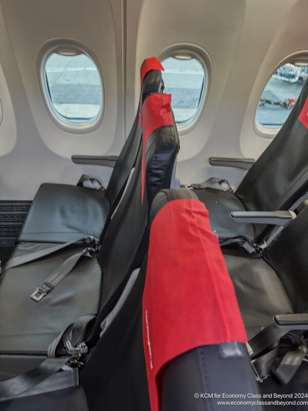 seats in an airplane with windows