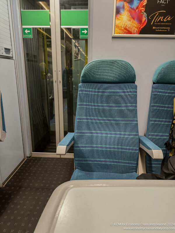 a blue chairs in a train