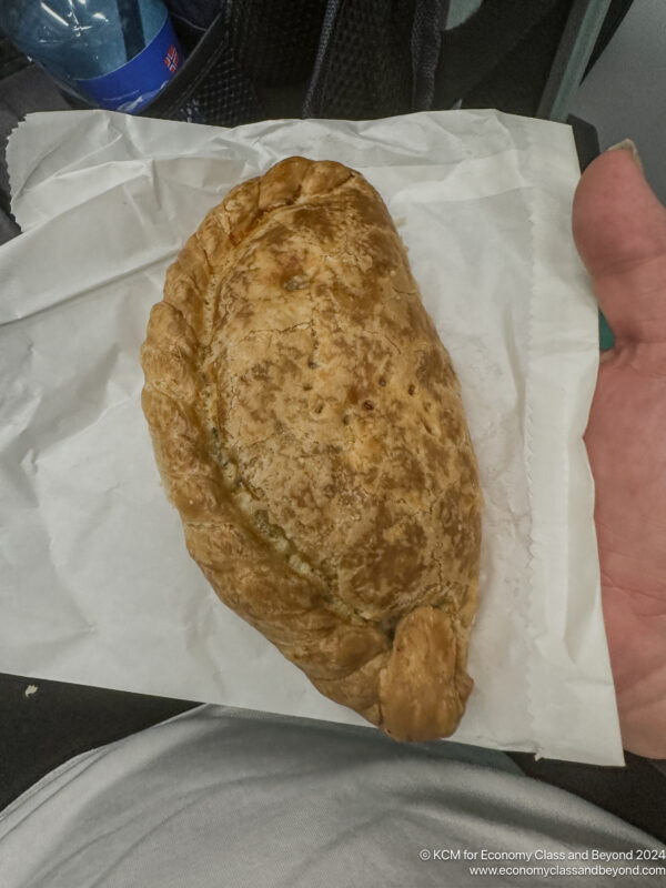 a hand holding a pastry