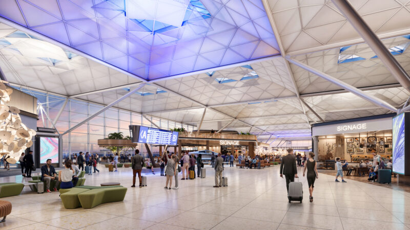 a large airport with people walking around