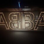 a sign with lit up letters