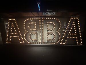 a sign with lit up letters
