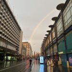 a rainbow over a city street