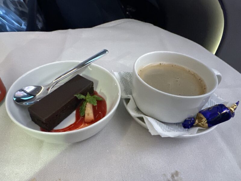 a bowl of chocolate cake and a cup of coffee