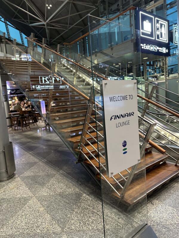 a glass staircase with a sign