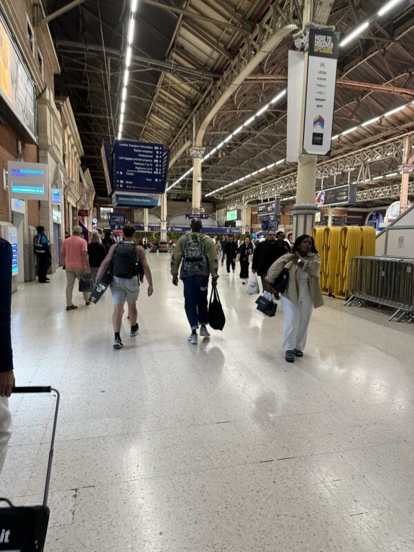 a group of people walking in a large building