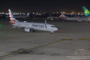 airplanes on a runway at night