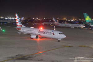 a group of airplanes on a runway