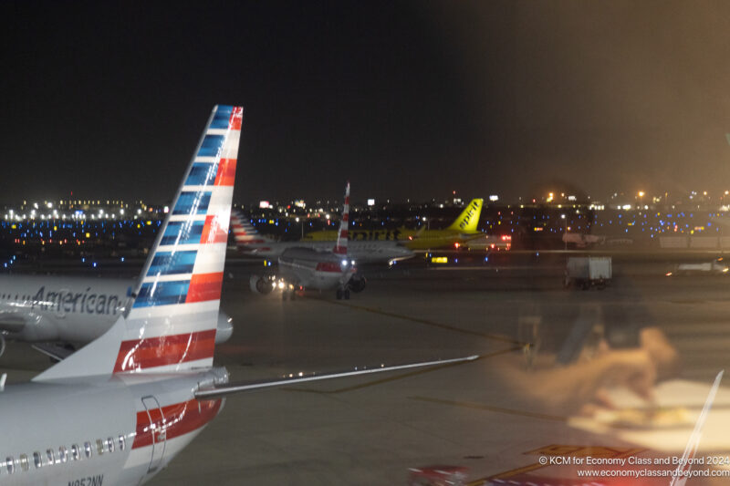 airplanes at an airport at night