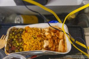 a tray of food with yellow wires