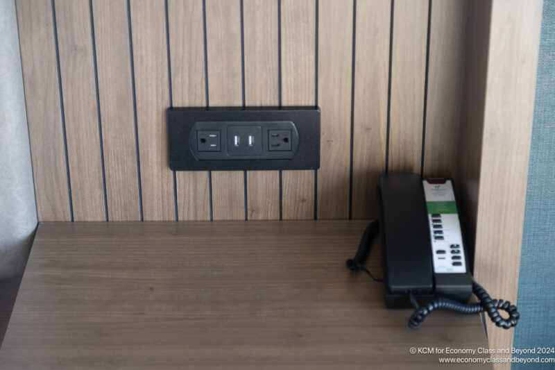 a telephone and outlet on a wall