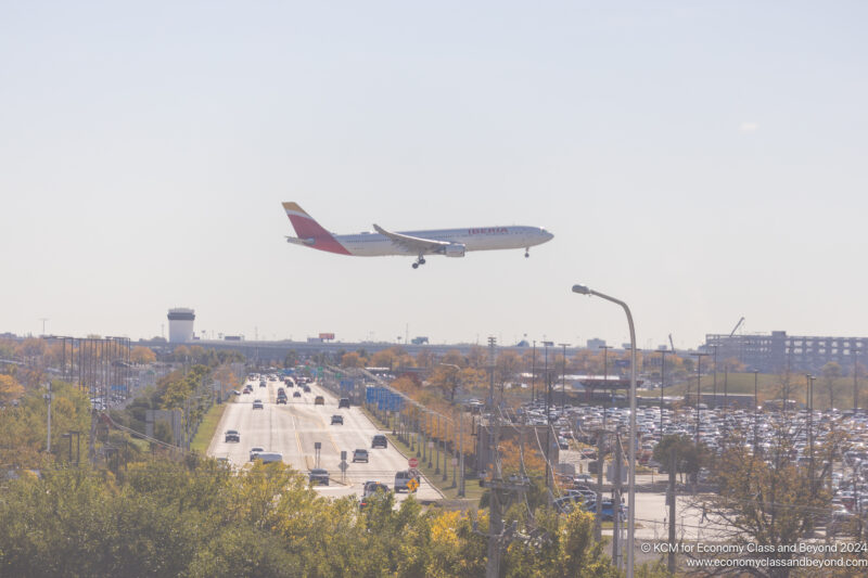 a plane flying over a road