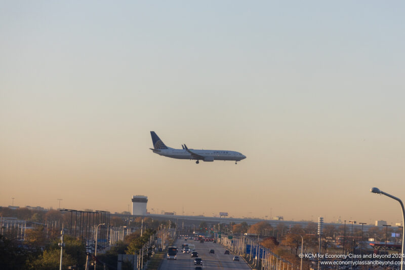 a plane flying over a road