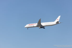 a white airplane flying in the sky