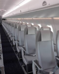 a row of white seats in an airplane