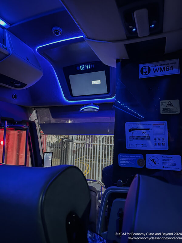 inside a vehicle with a screen and a blue light