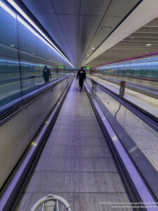 a person walking on an escalator