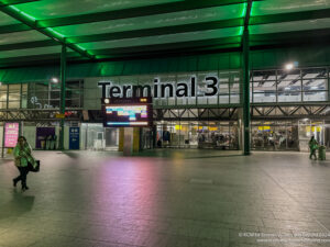 a large building with green lights