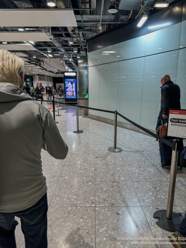 a man standing in a hallway with a rope around it