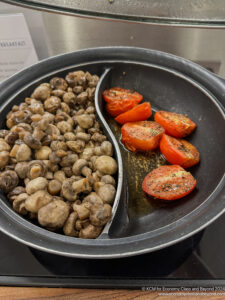 a plate of mushrooms and tomatoes