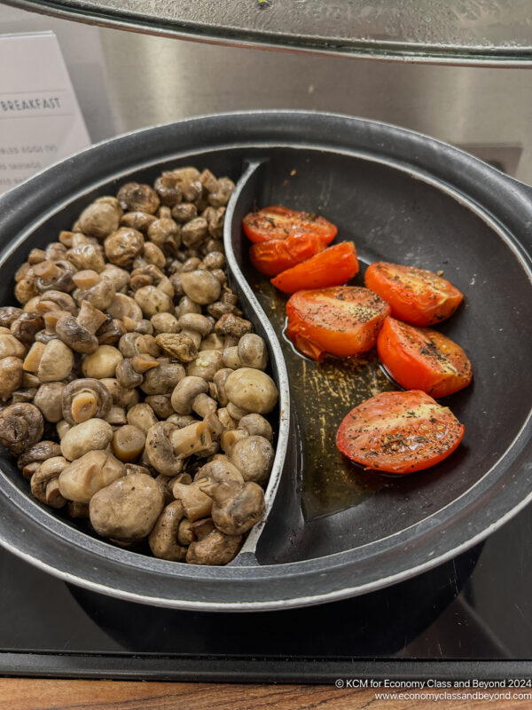 a plate of mushrooms and tomatoes