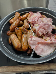 a pan of sausages and meat