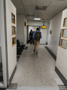 a group of people walking in a hallway