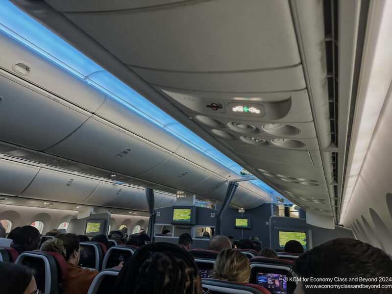 a group of people sitting in an airplane