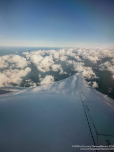 an airplane wing and clouds