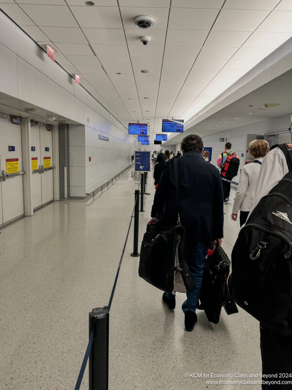 a group of people walking in a hallway