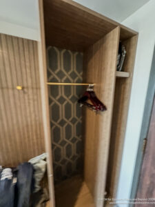 a closet with clothes in it
