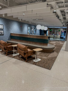 a reception area with chairs and a table