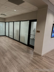 a room with glass doors and a wood floor