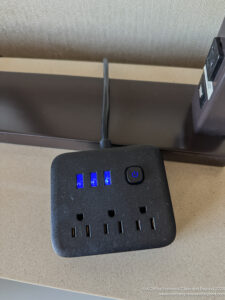 a black power strip with blue lights