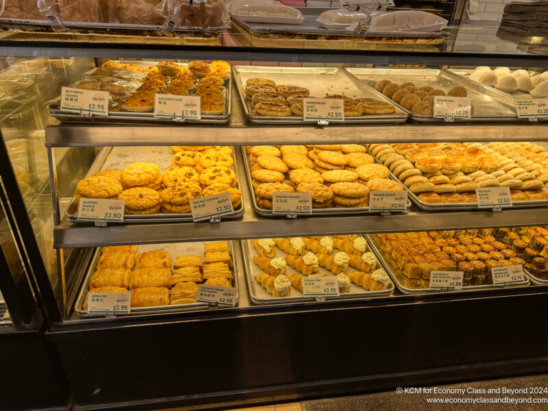 a display of pastries on shelves