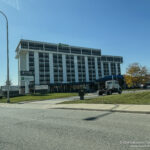 a large building with a tractor parked in front of it