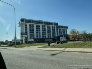 a large building with a tractor parked in front of it