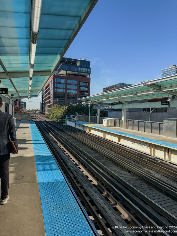 a person standing at a train station