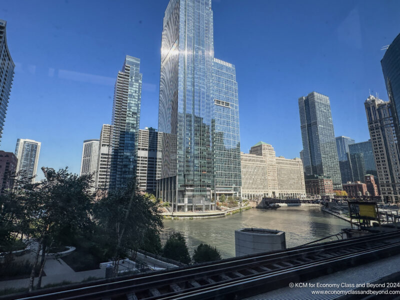 a train tracks next to a city