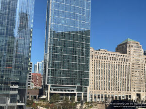 a tall glass building with many windows