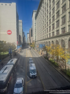 a city street with cars and buses