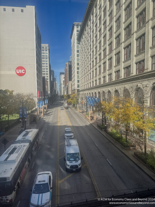 a city street with cars and buses