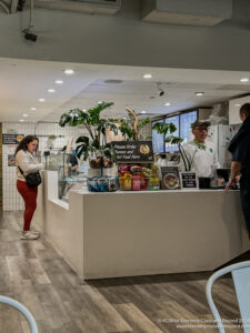 a man and woman standing in front of a counter